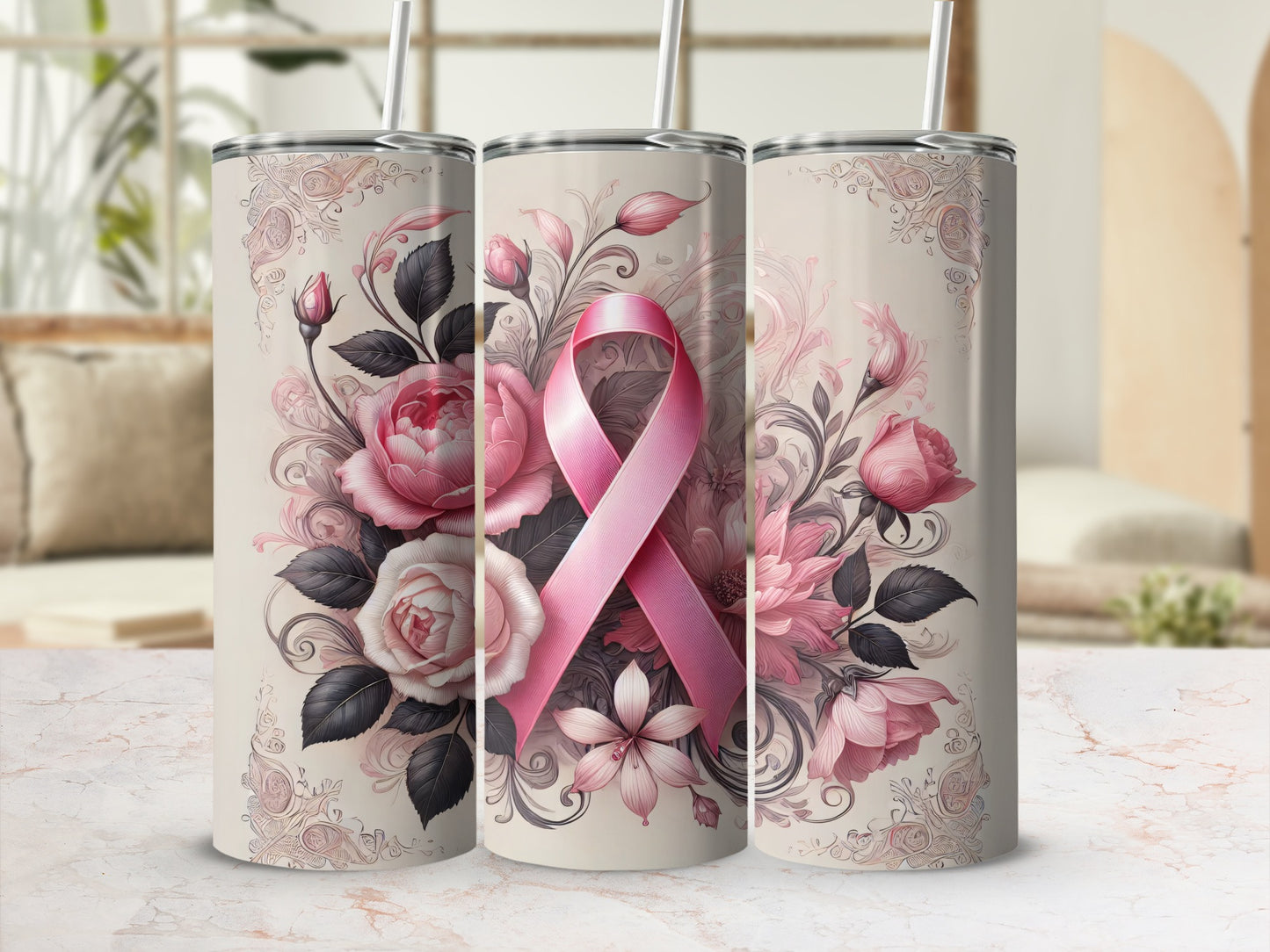 Pink ribbon and floral design on three stainless steel tumblers.