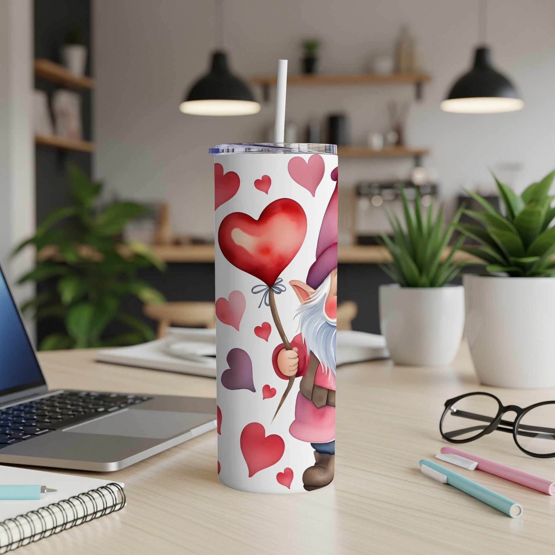 Gnome holding a heart balloon on a patterned tumbler.