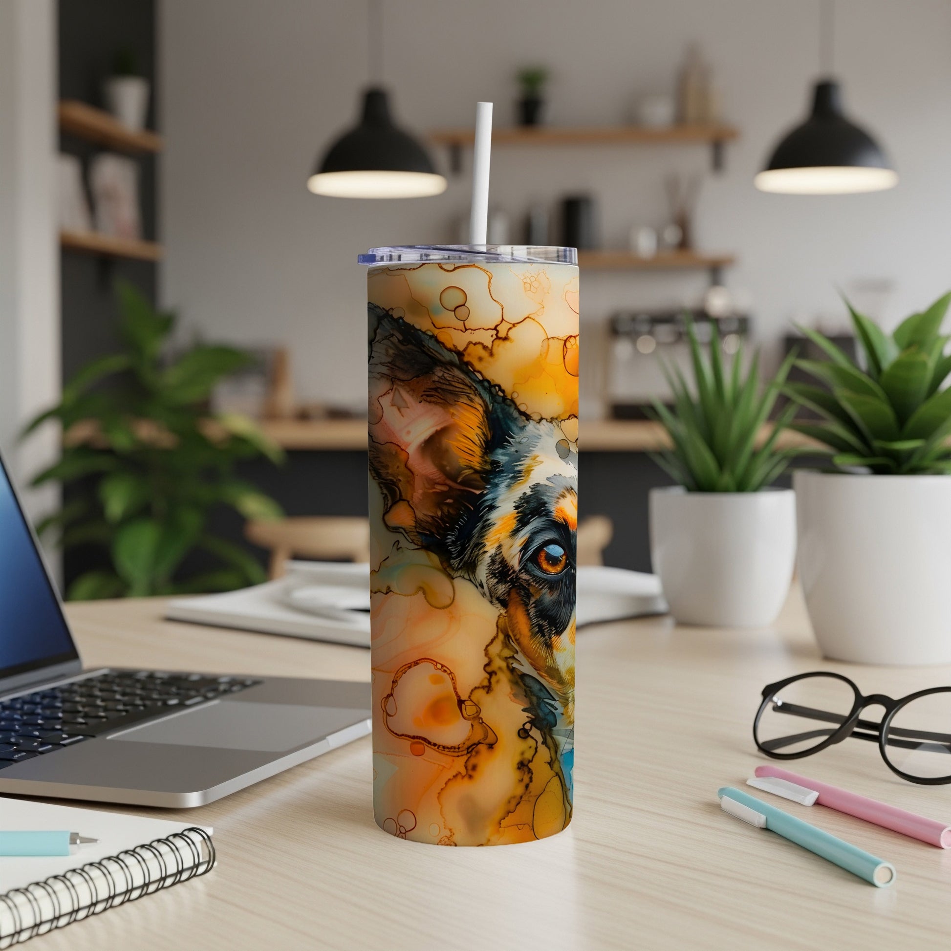Dog's eye and nose on a colorful abstract tumbler with straw.