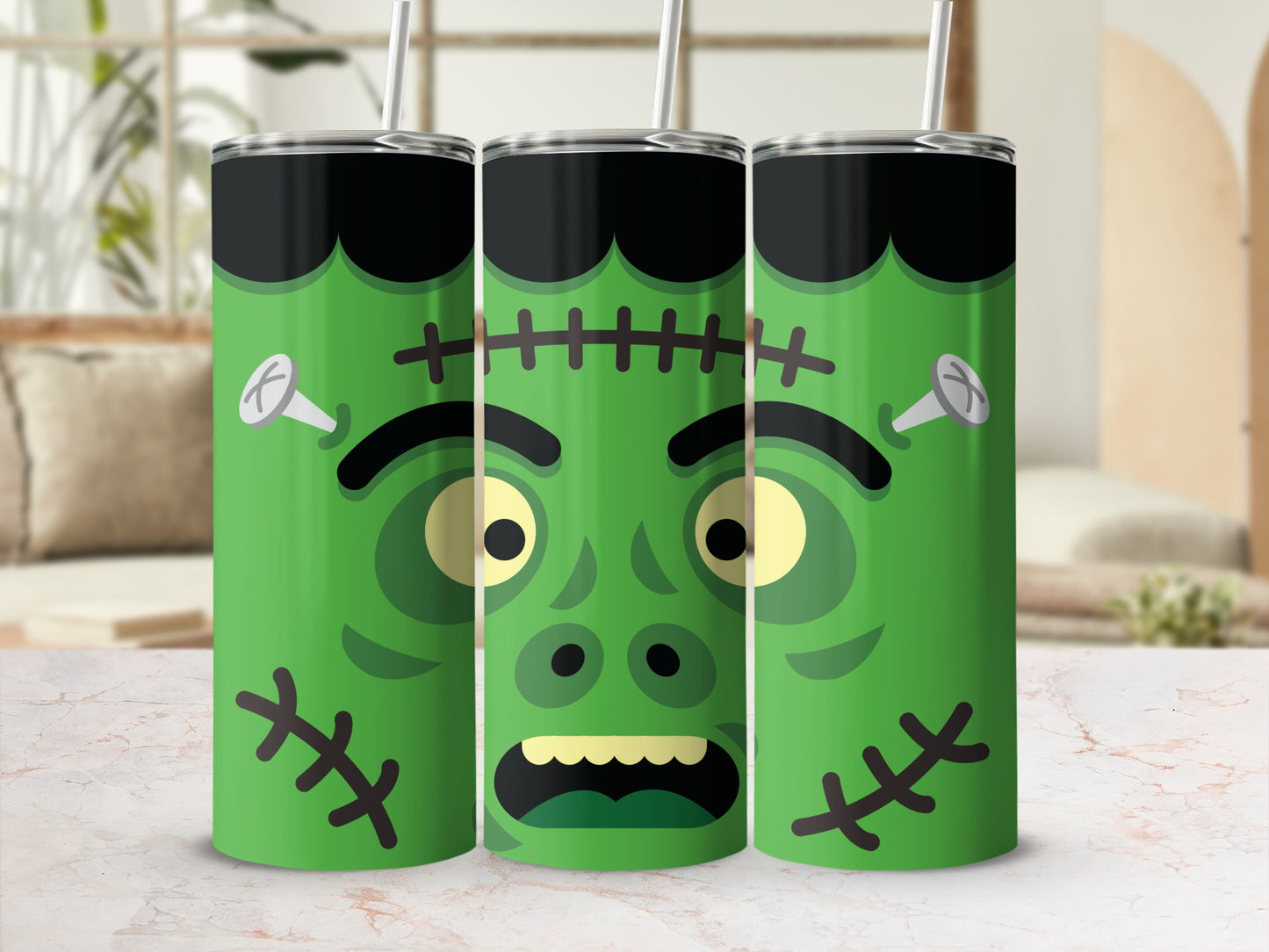 Three green Frankenstein tumblers with straws, featuring stitches and bolts.