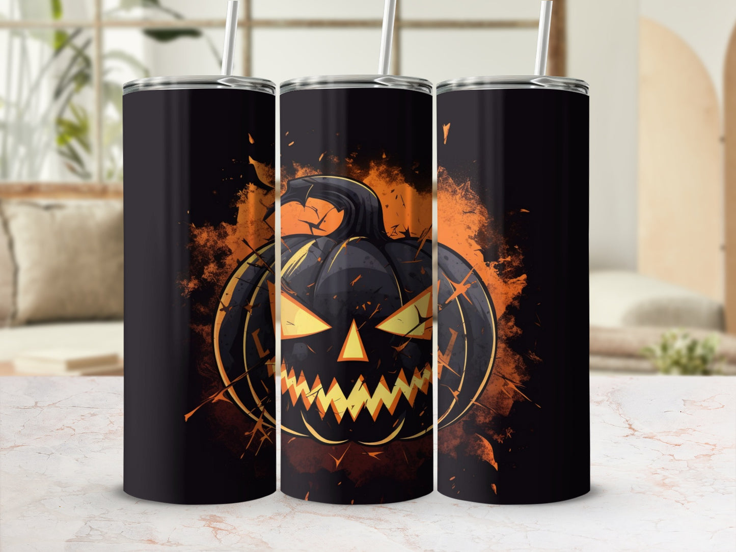 Three tumblers with a spooky black jack-o'-lantern design on an orange background.