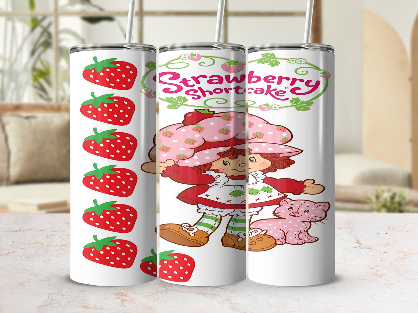 Strawberry Shortcake character with strawberries and pink cat design on a tumbler.
