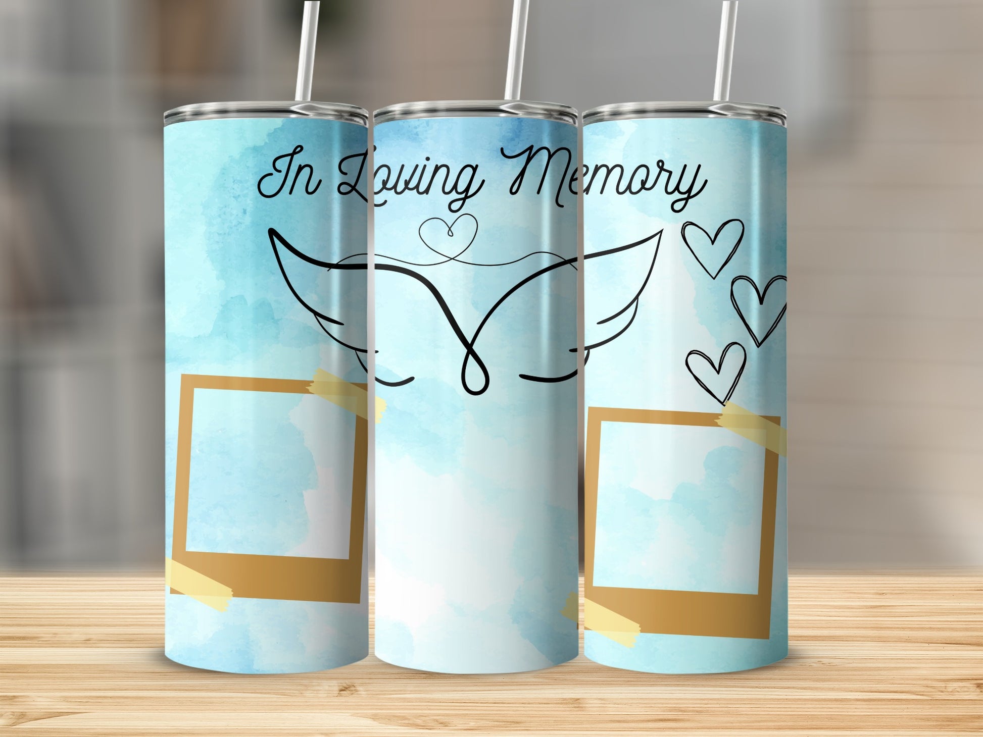 Three tumblers with "In Loving Memory" text, angel wings, hearts, and photo frames.