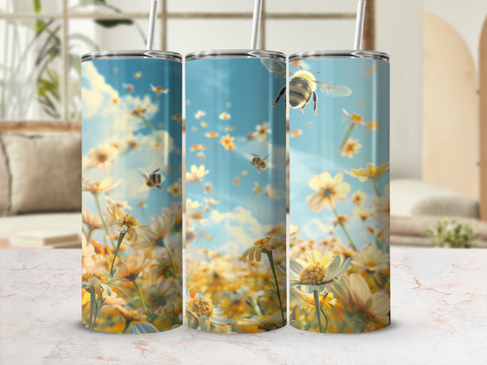 Three tumblers display a field of yellow daisies with bees in flight.