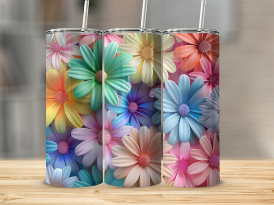 Three colorful tumblers with floral patterns arranged on a wooden surface.