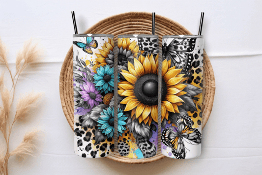 Daisies with butterflies and colorful tumbler