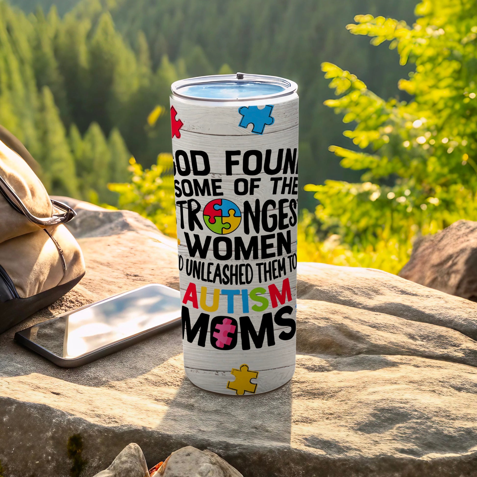 Tumbler with "God found some of the strongest women to unleash them to autism moms" text and puzzle pieces.