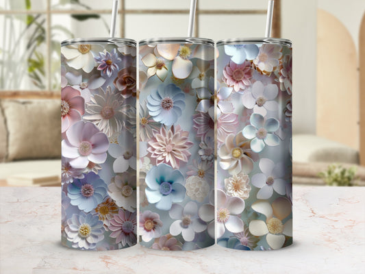Three tumblers adorned with a floral pattern of pale blue, pink, and cream flowers.