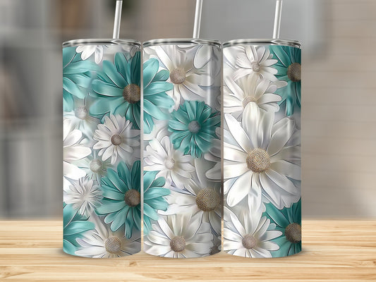 Three tumblers with teal and white daisy floral pattern on a wooden surface.