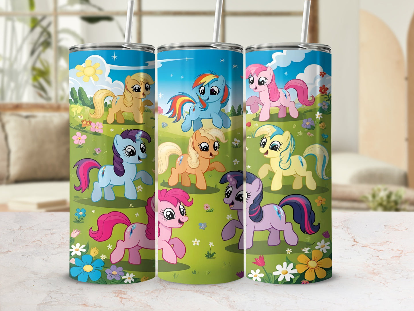 Three tumblers featuring colorful cartoon ponies with floral backgrounds.