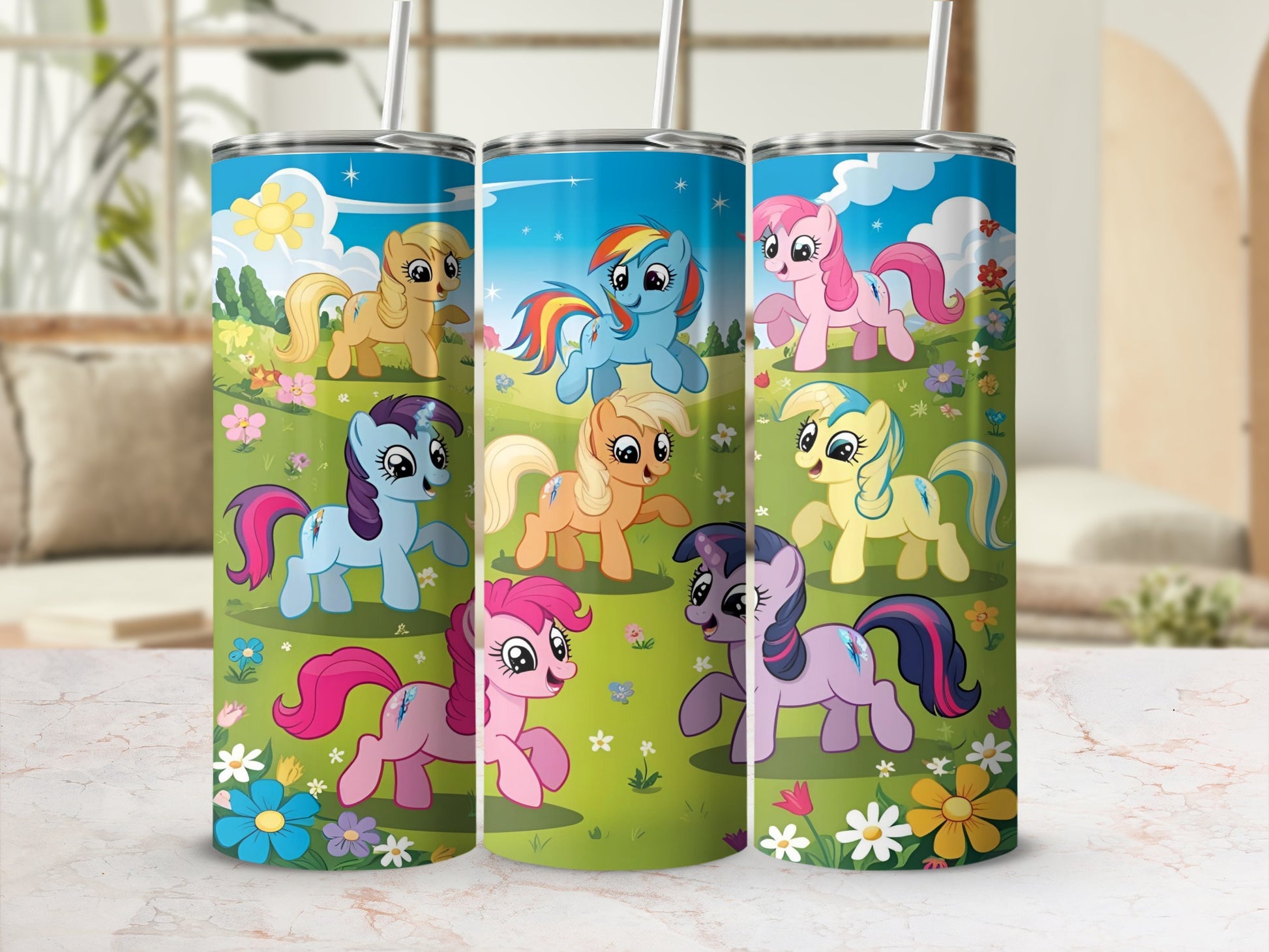 Three tumblers featuring colorful cartoon ponies with floral backgrounds.