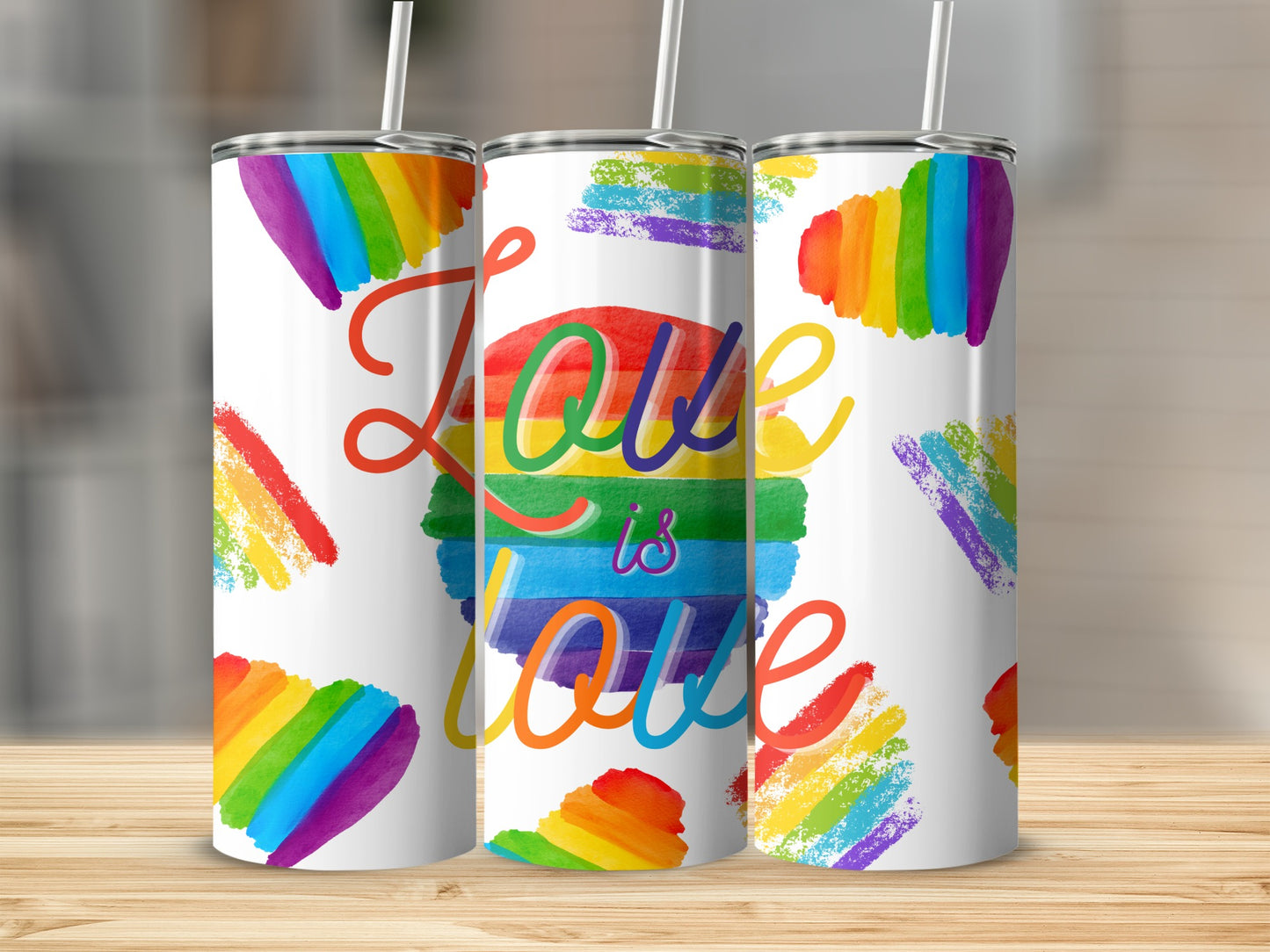 Tumblers with "Love is Love" and rainbow flag designs.