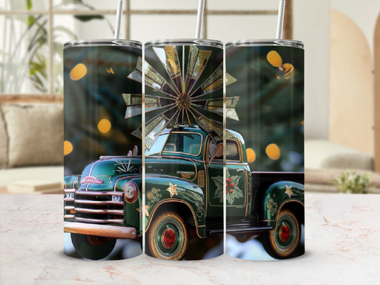 Green vintage truck with holiday design and windmill decoration.