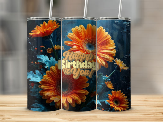 Orange gerbera daisies and "Happy Birthday to You!" text on a tumbler.