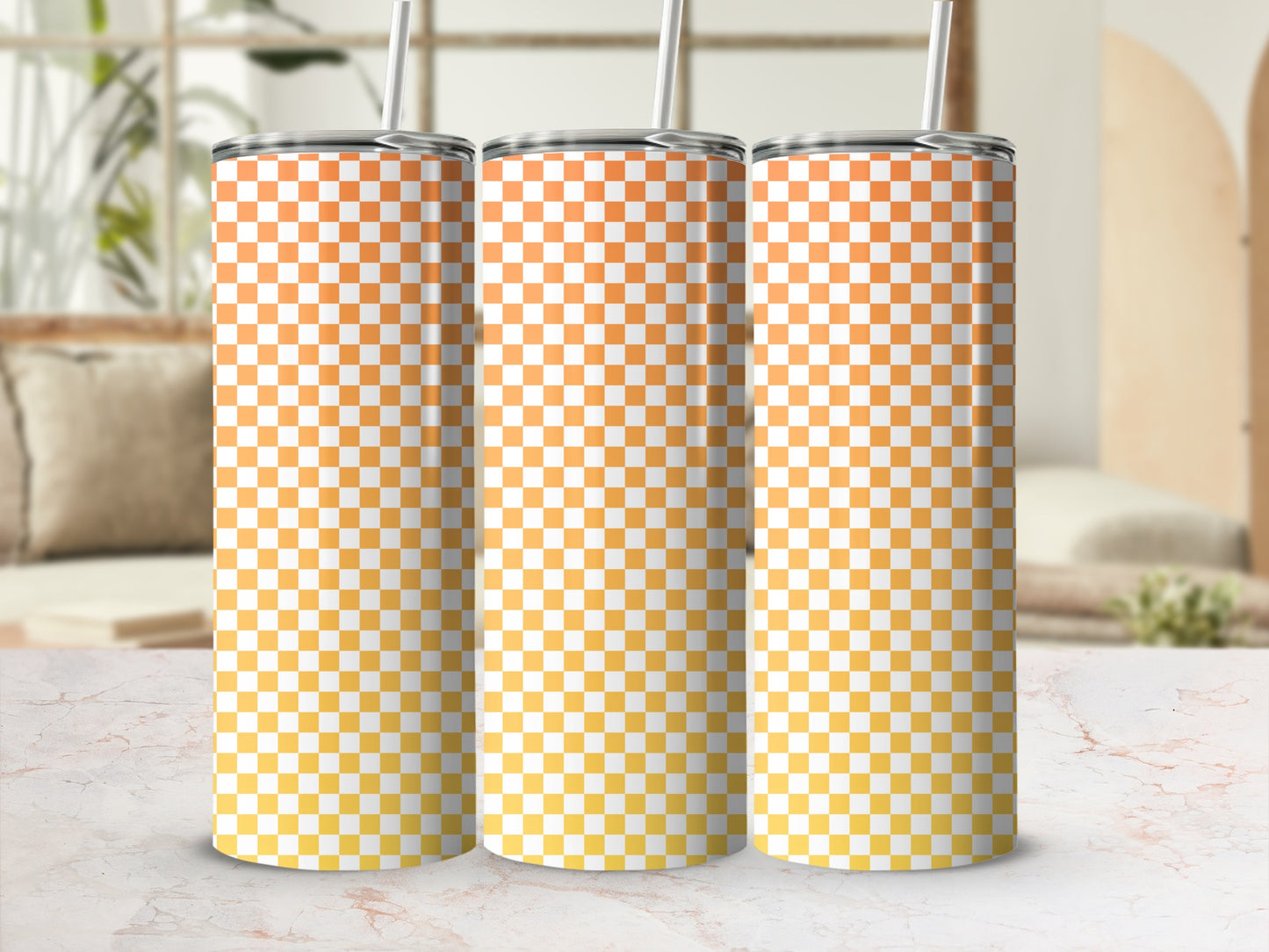 Three tall tumblers with an orange and yellow checkered pattern.