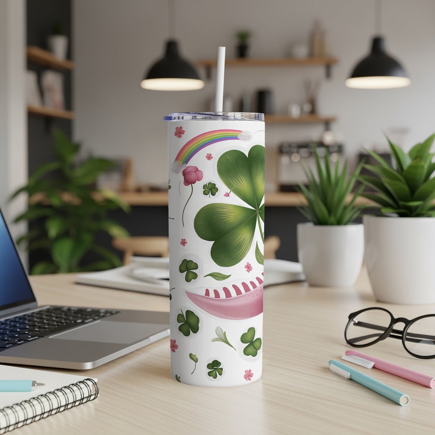 Tumbler with shamrocks, rainbow, and floral designs.