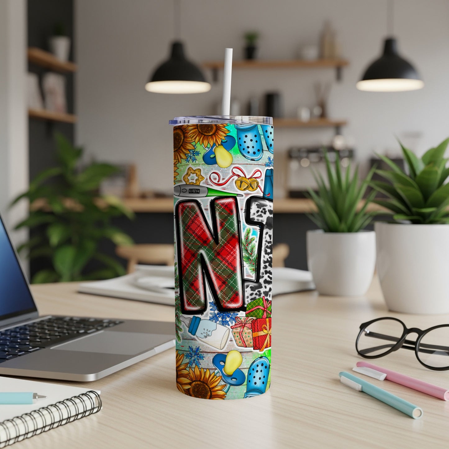 Tall tumbler with "Nurse" and festive holiday designs including plaid, sunflowers, and presents.