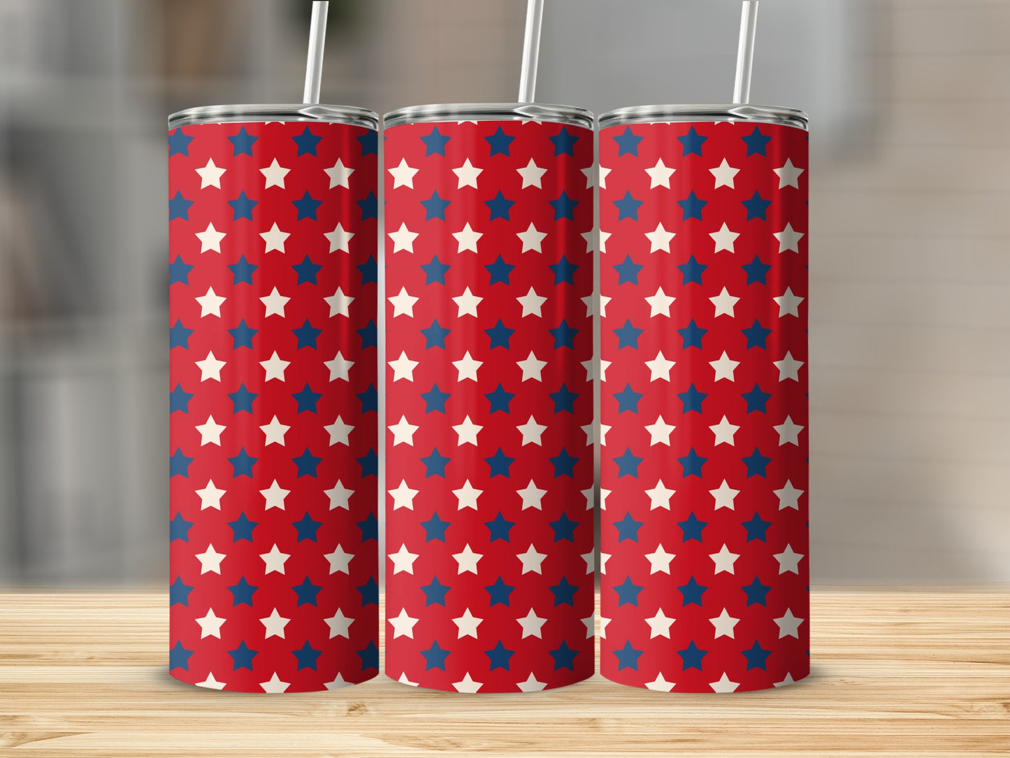 Three tumblers with red, white, and blue stars pattern and straws.