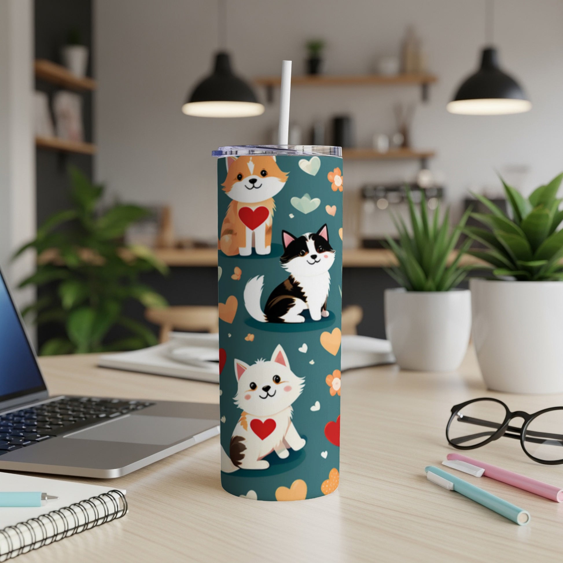 Two cute cats and a fox-like animal on a teal tumbler.