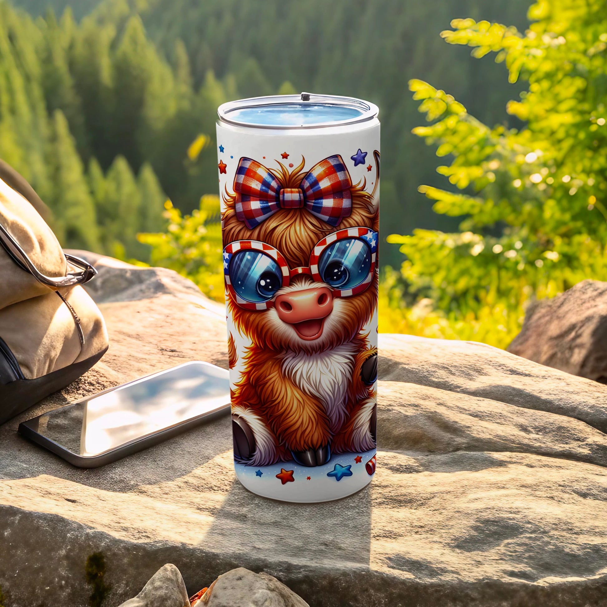 Fluffy Highland cow wearing patriotic sunglasses and bow on tumbler.