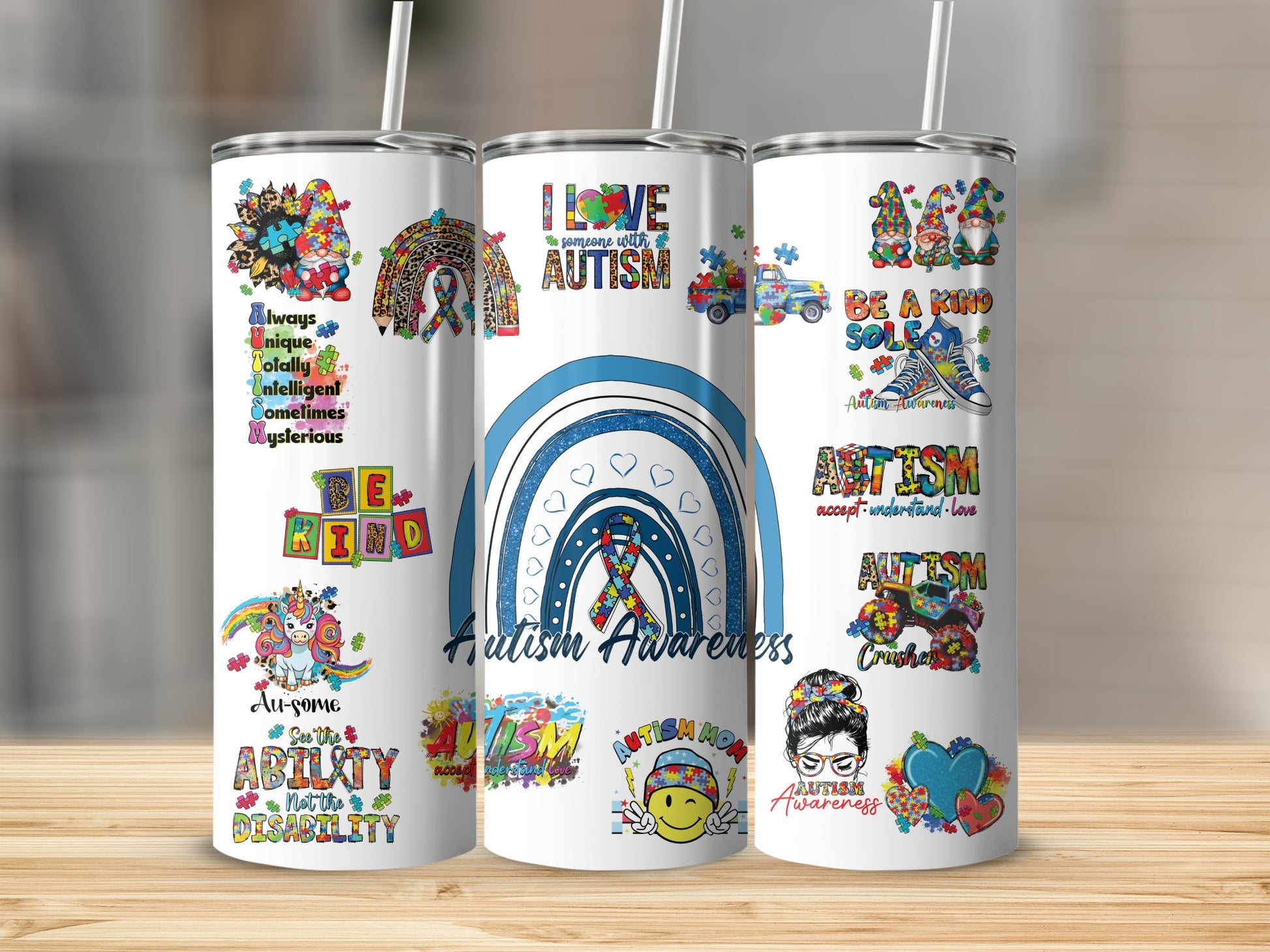 Three tumblers featuring autism awareness themes, rainbows, and positive affirmations.