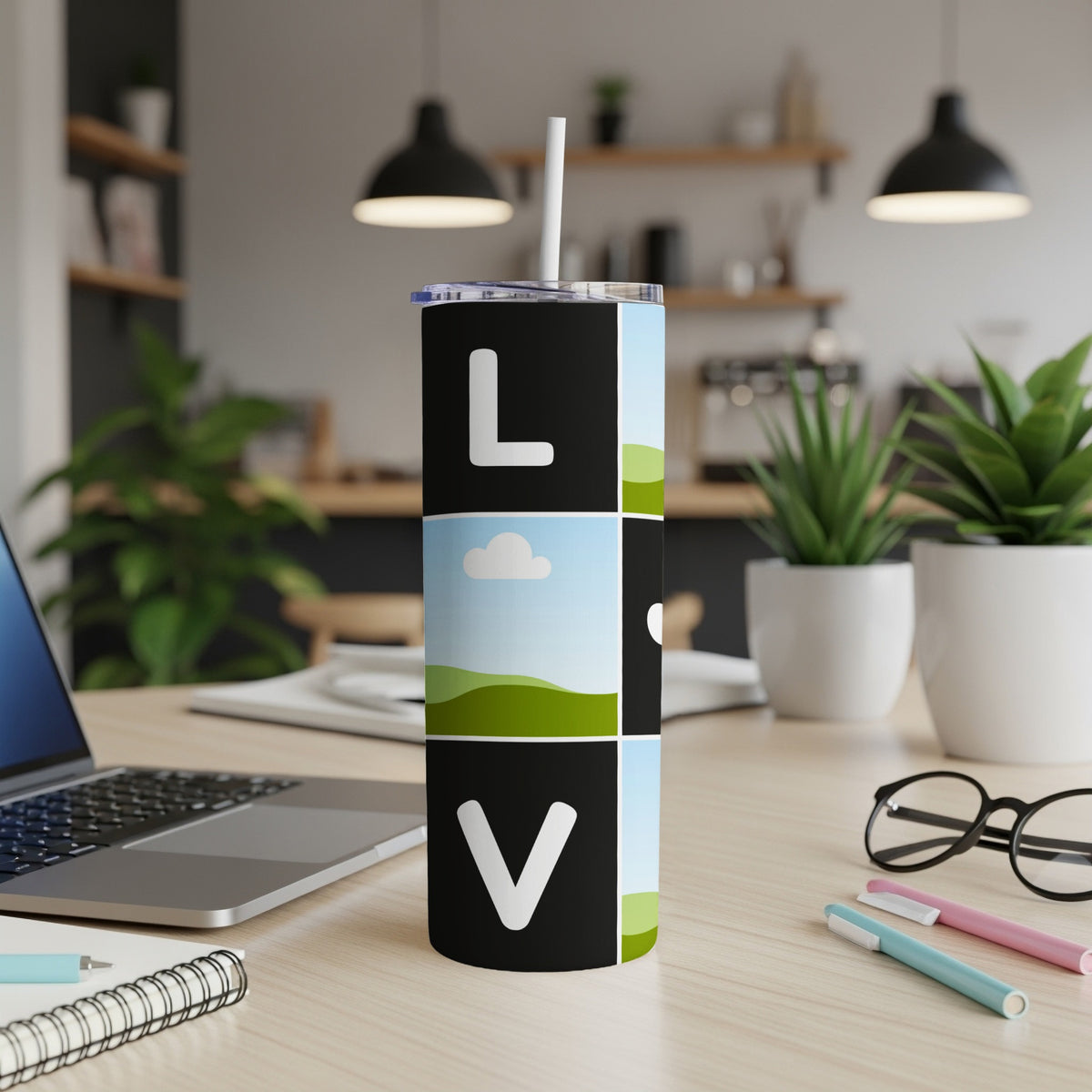 Tumbler with L V design and landscape images with a straw.