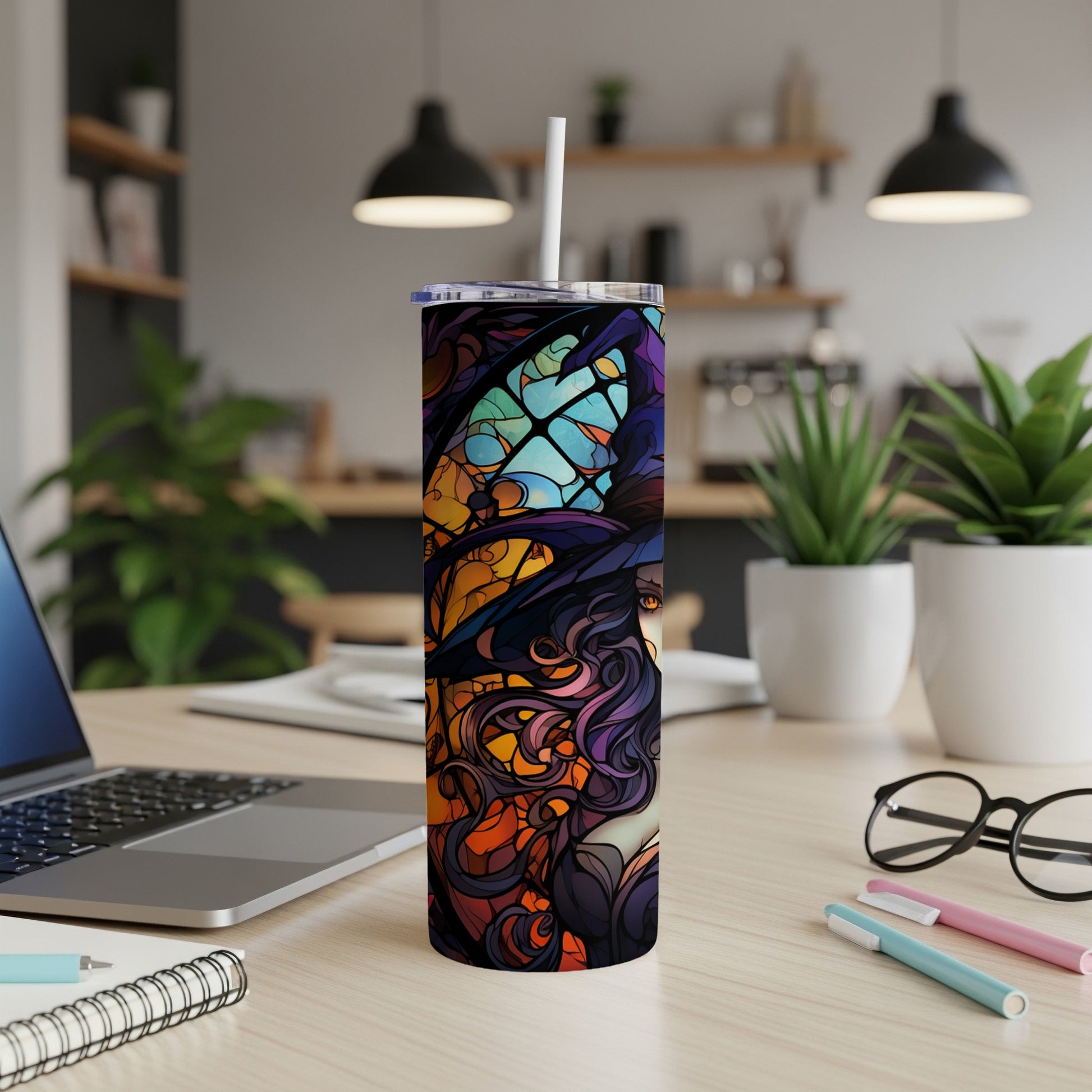 Tall tumbler with witch and stained glass design.