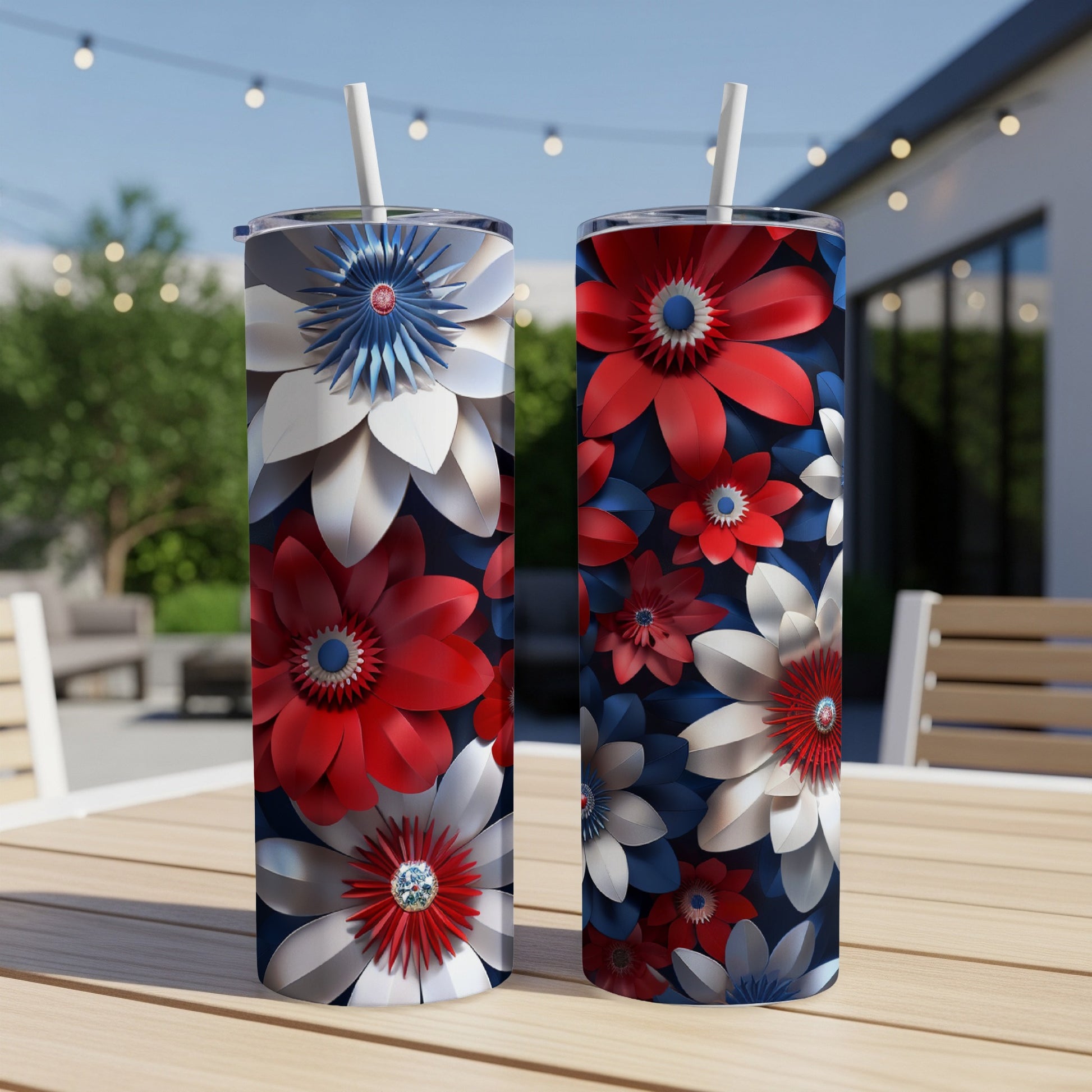 Two red, white, and blue patriotic floral print tumblers on a wooden table.