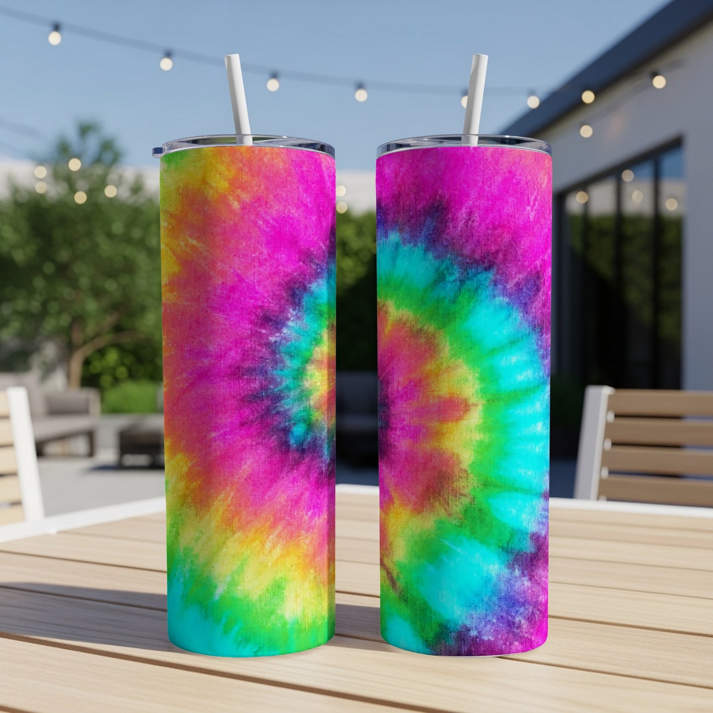 Two tie-dye tumblers with pink, blue, yellow, and green swirls.