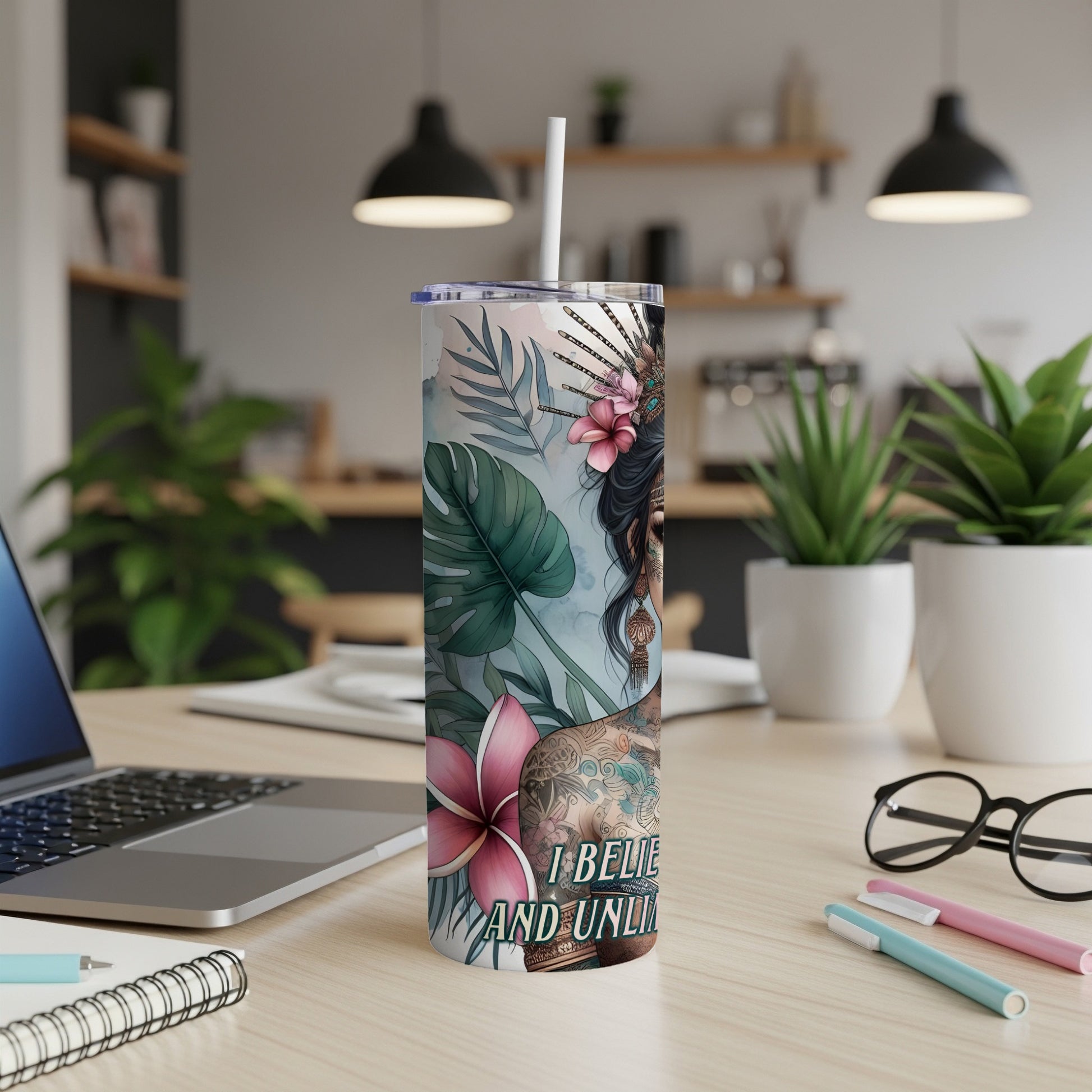 Floral tumbler with woman's portrait and text "I Believe and Unleash".