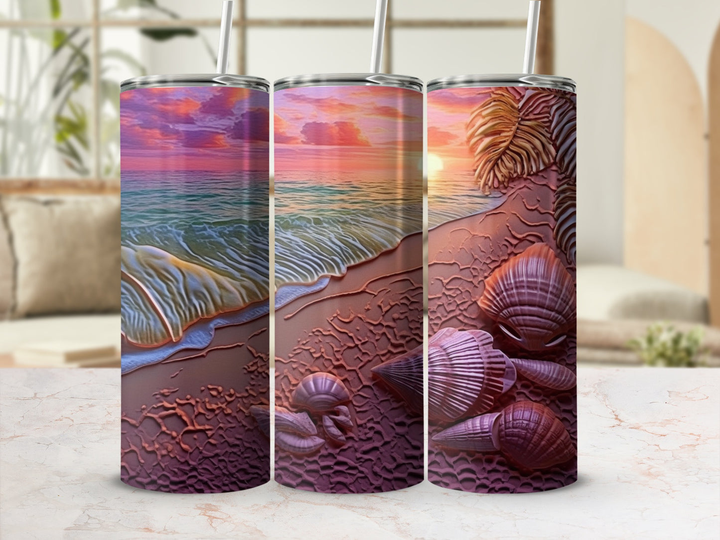 Three tumblers with a seashell and sunset beach design.