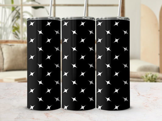 Black tumbler with a repeating pattern of white starbursts.