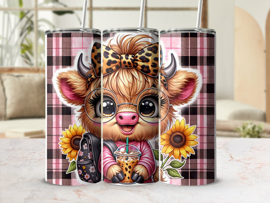 Cute cow with bow and glasses holding iced coffee, on pink plaid background.