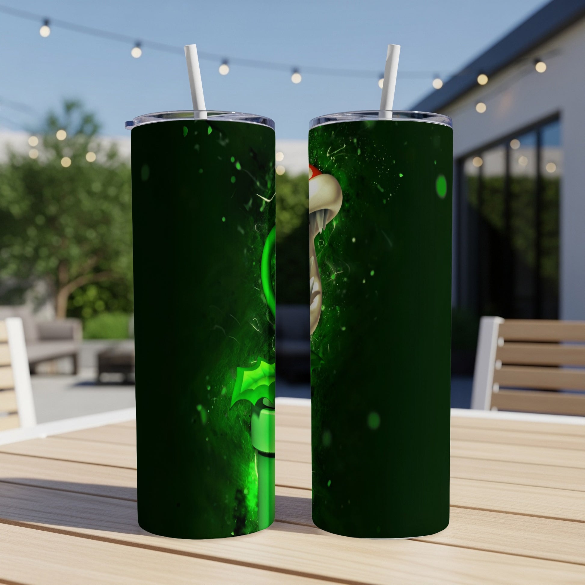 Green Grinch character on a dark green tumbler with straw, outdoors.