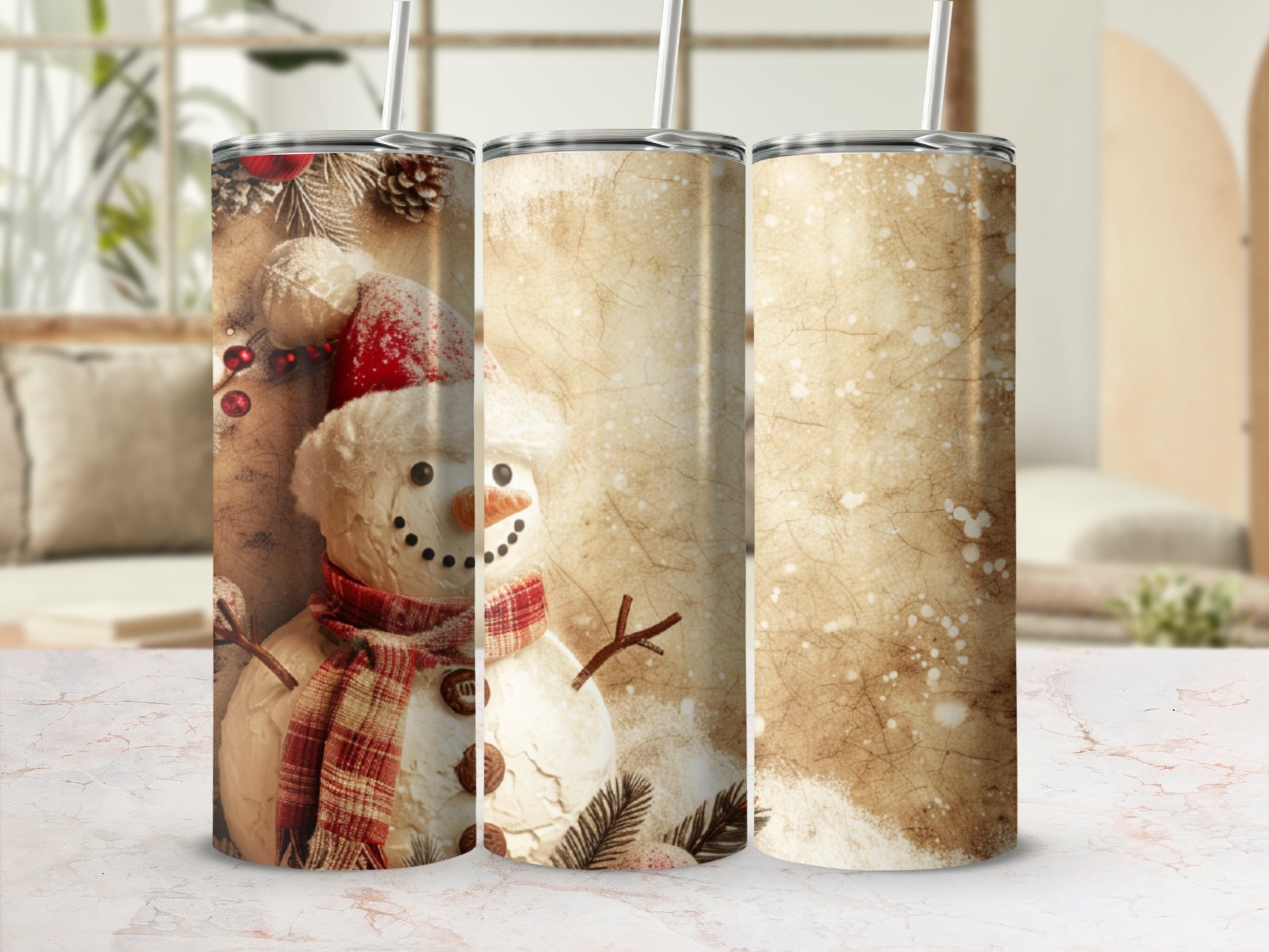 Three tumblers featuring a snowman design with a festive scarf and hat.