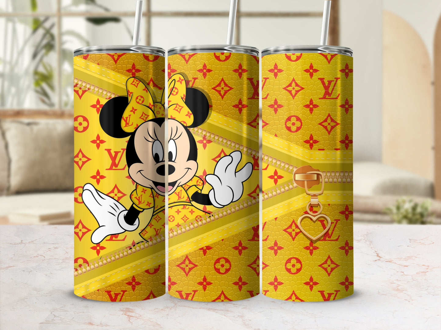Minnie Mouse on yellow tumbler with repeating red logo pattern and gold zipper.