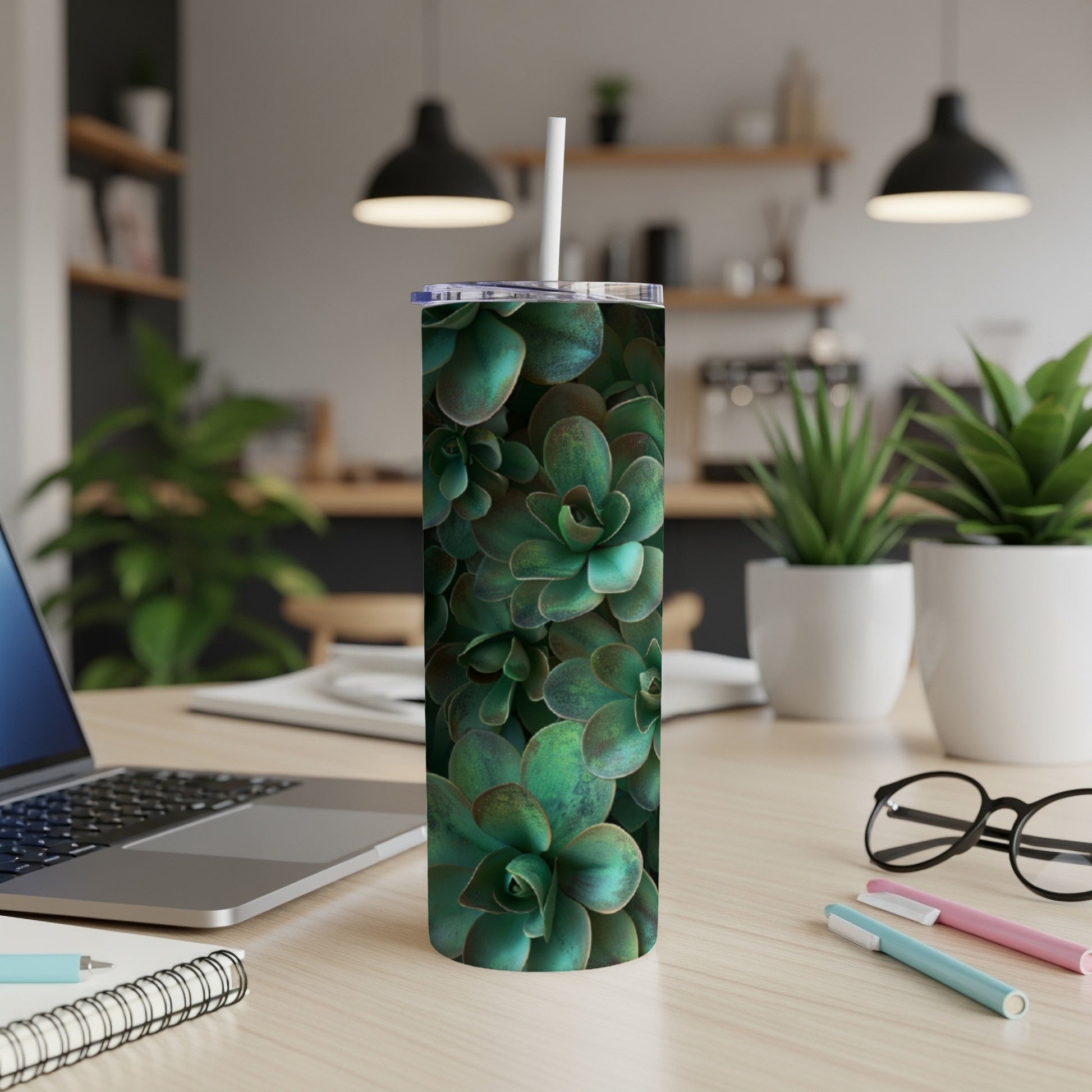 Succulent plant pattern on a stainless steel tumbler with straw.