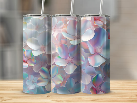 Three floral tumblers with iridescent petals on a wooden surface.