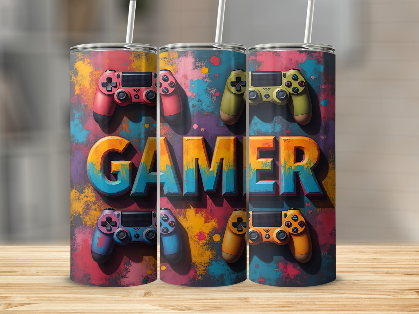 Three tumblers featuring colorful game controllers and the word "GAMER" in large letters.
