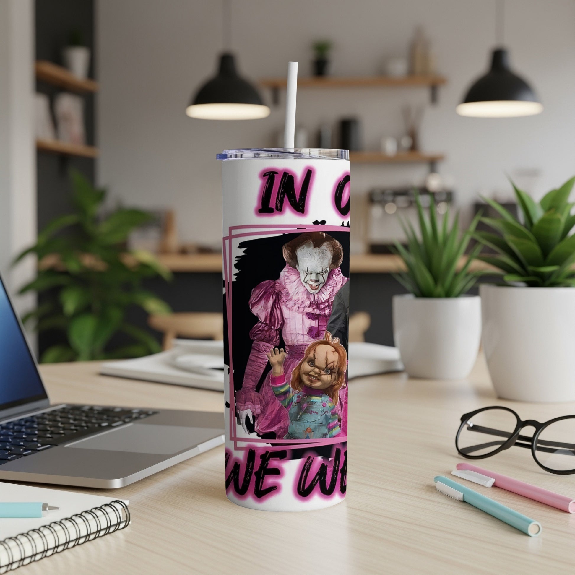 White tumbler with Pennywise and Chucky graphics and pink text.