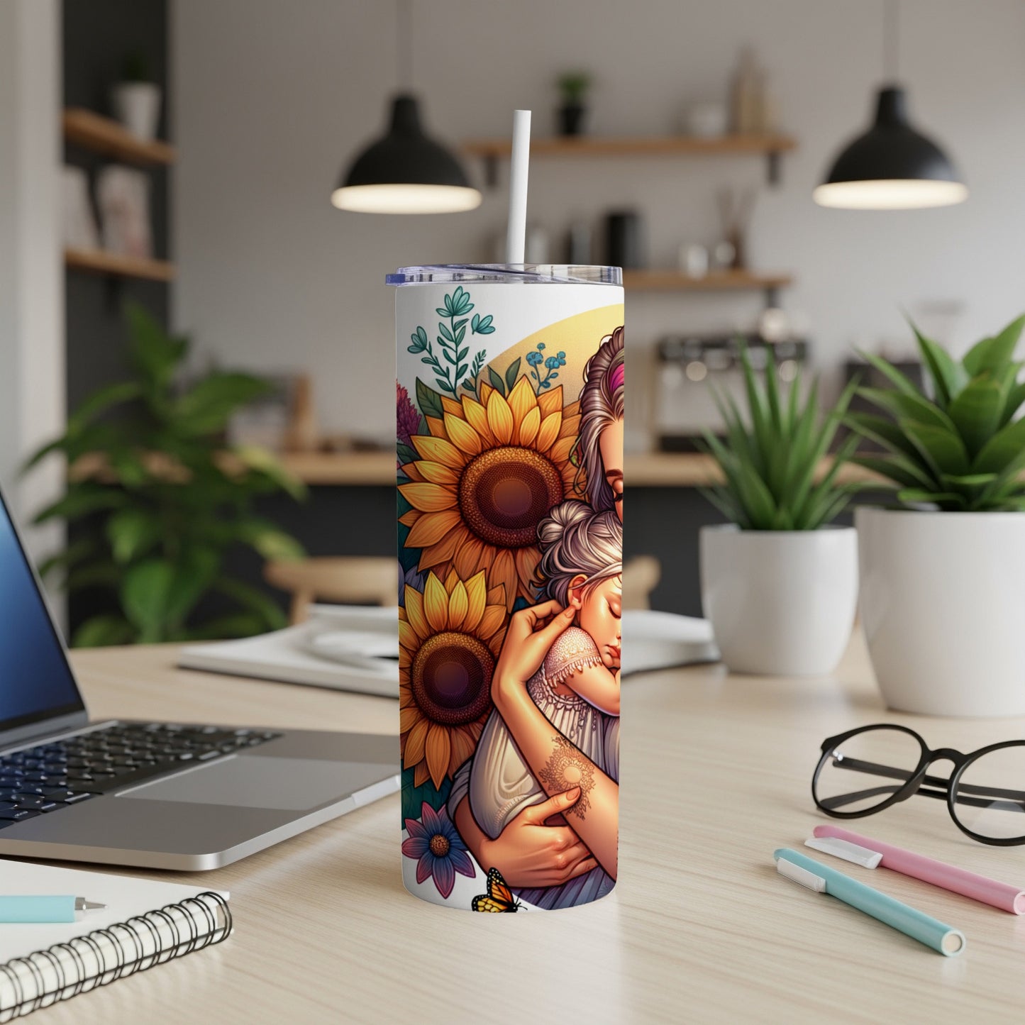 Tumbler with illustration of mother and child embracing among sunflowers and butterflies.