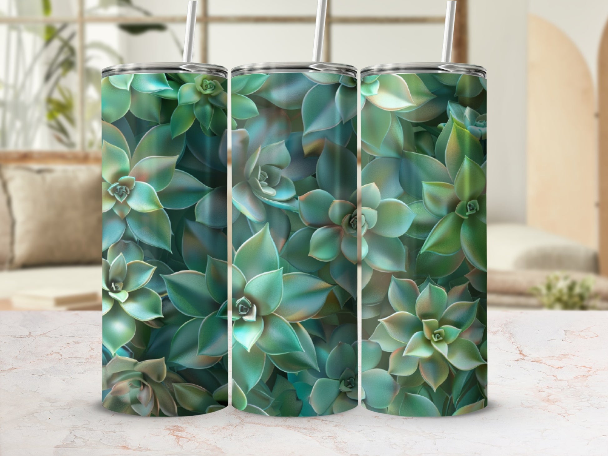 Three tumblers with a succulent plant pattern on a marbled surface.