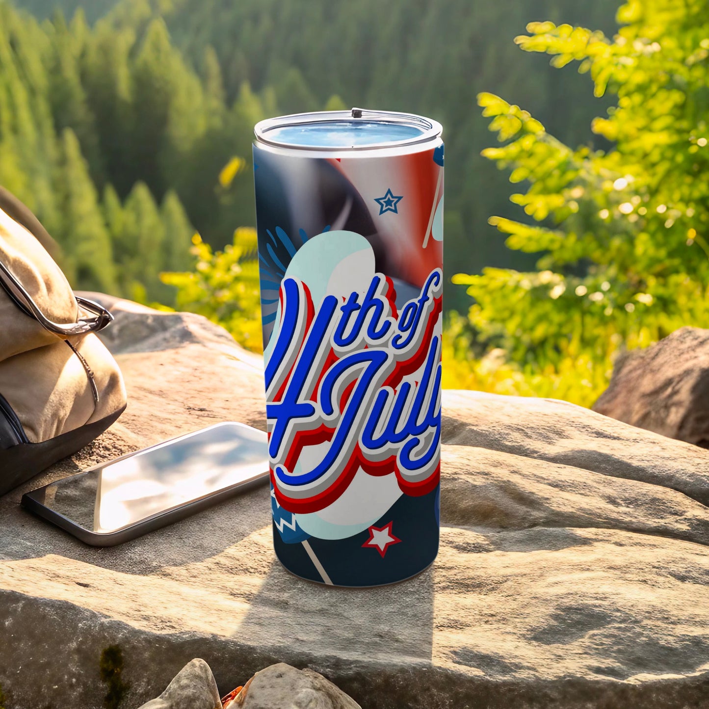 4th of July tumbler with patriotic design on outdoor surface.