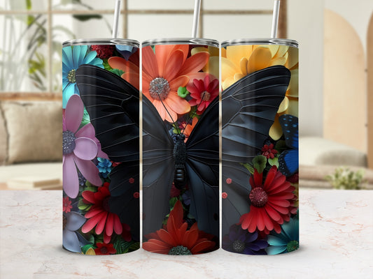 Three tumblers with black butterflies and colorful floral designs.