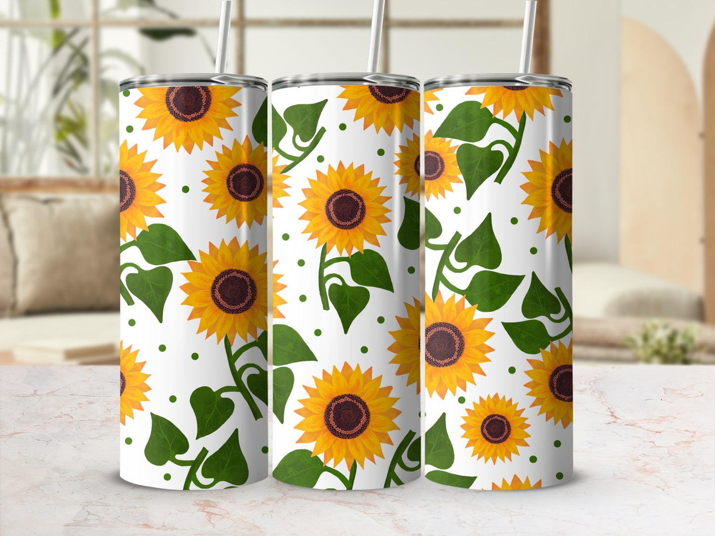 Three tumblers with a repeating sunflower pattern and green leaves.