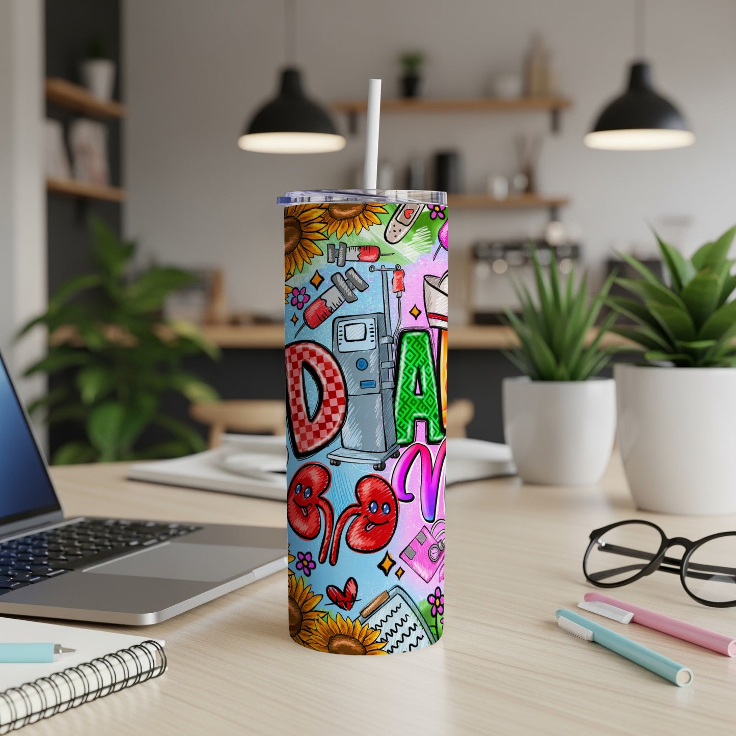 "D" graphic on a tumbler with medical icons, sunflowers, and colorful graffiti.