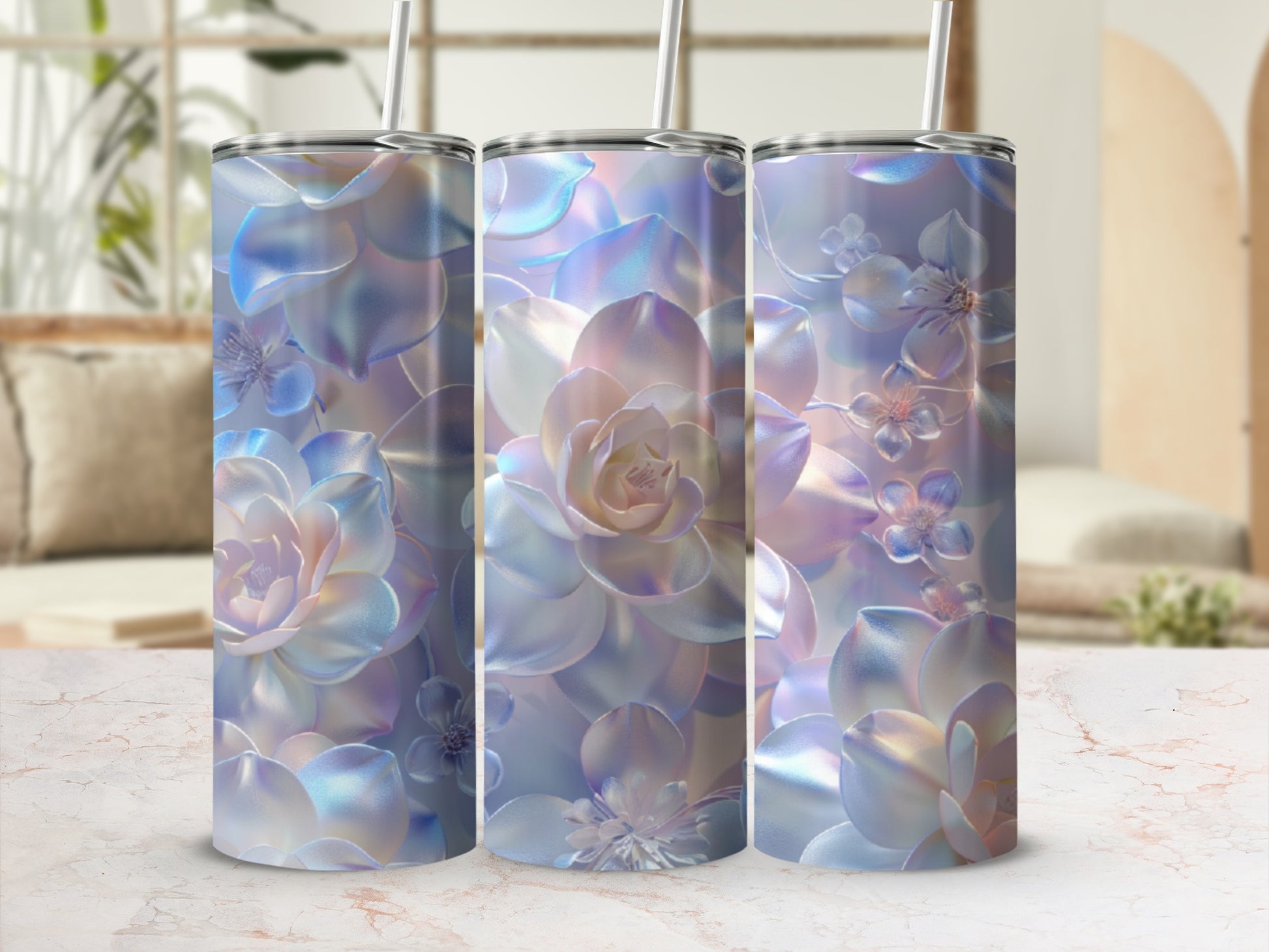 Three iridescent tumblers with floral succulent designs, in a bright room setting.