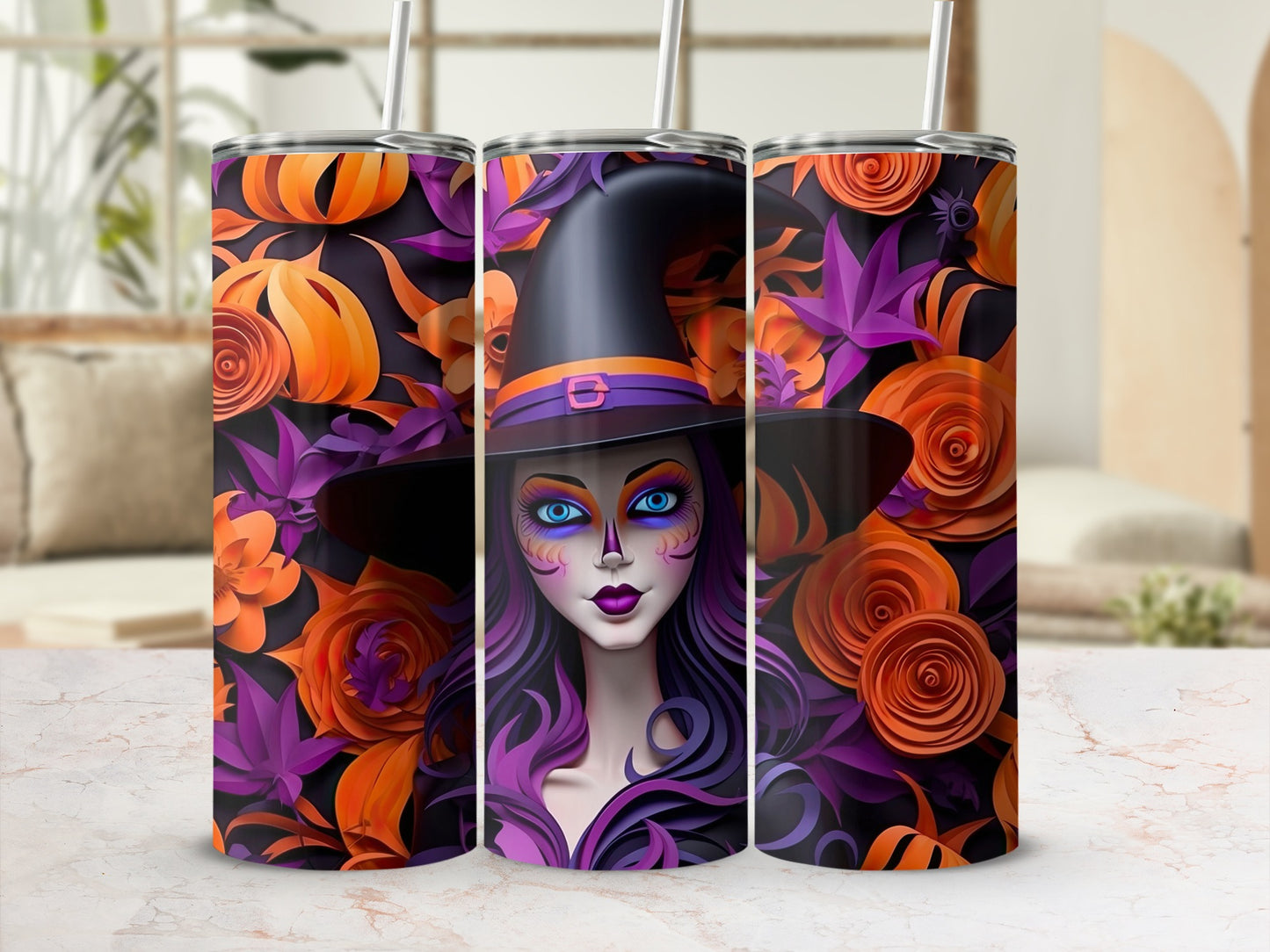 Three tumblers with Halloween witch and floral designs featuring pumpkins and roses.
