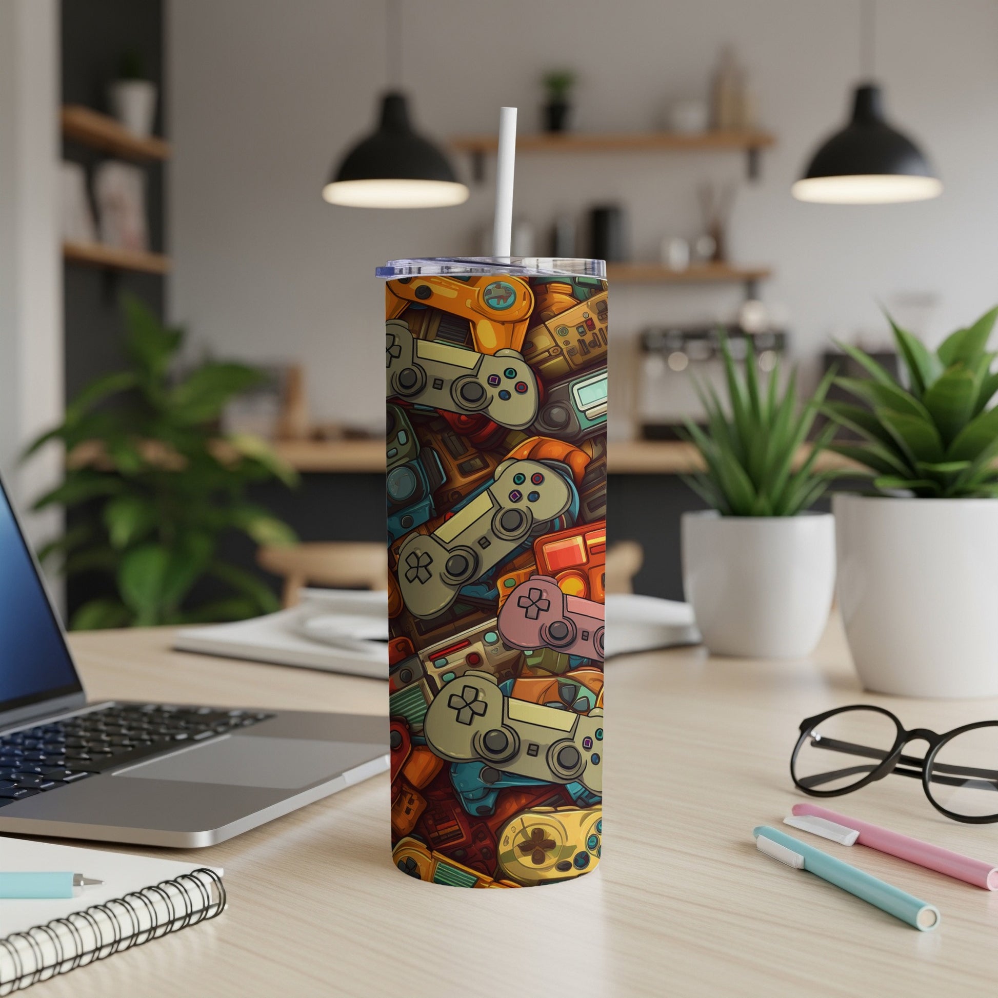 Colorful cartoon video game controllers and consoles pattern on a tumbler.