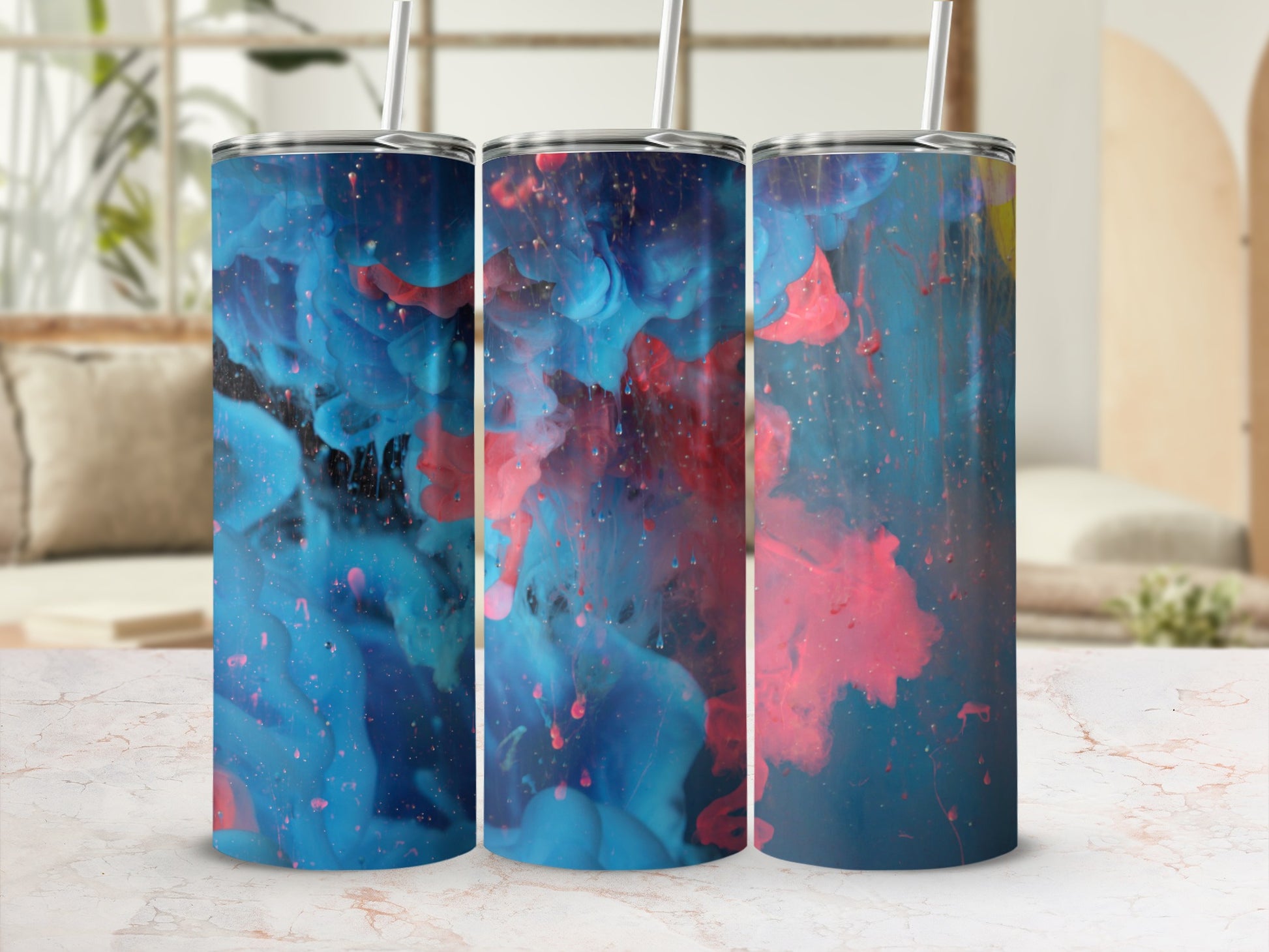 Three tumblers with swirling blue and pink abstract paint designs.
